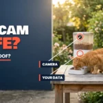 White smart pet feeder with a built-in camera on a garden table with a ginger cat eating, labeled camera and your data, asking whether a pet cam is safe